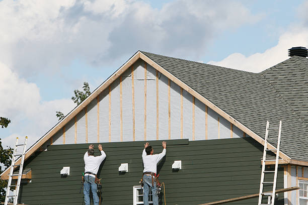 Professional Storm Damage Siding Repair technician working in Carson, VA
